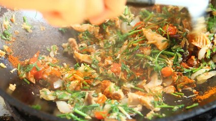 Wall Mural - Man is frying  Masala  with herbs in pan, in door Chiangmai Thailand