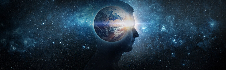 Wall Mural - Earth Day 22April concept. Planet earth inside a human silhouette on the background of the universe. Elements of this image furnished by NASA.