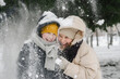 © Westend61 - Cheerful son and mother enjoying in snow