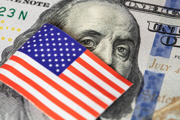 U.S. 100 dollar banknote on american flag background