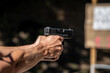 © edojob - shooting from a pistol at a target on a shooting range