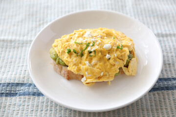 Wall Mural - Avocado and scrambled eggs toast