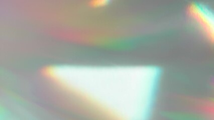 Wall Mural - Bright Beam Reflections. Loop. The optical lens system creates a series of bright, changing geometric highlights on a light surface