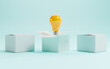 © Dilok - Yellow lightbulb inside of open white box between two close boxes on blue background for creative thinking idea concept by 3d render.