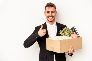 Wall Mural - Young caucasian business man fired from job isolated on white background smiling and raising thumb up