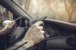 © Natallia - Man with a gun driving a car