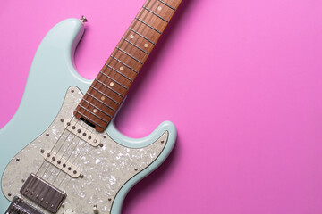 Sticker - Electric guitar on pink table background, close up music concept