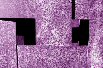 Wall Mural - Rusty abstract metal grit construction in purple tone.