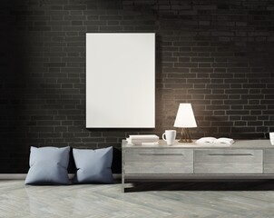 Wall Mural - Empty vertical frame on a black brick wall. Wooden console and pillows on the floor. 3D rendering.