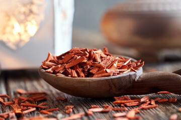 Wall Mural - Red sandalwood on a wooden spoon