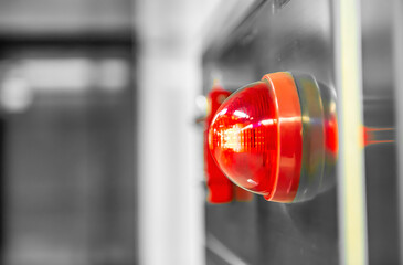 Warning red light for electrical control cabinet on the wall room.