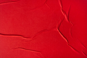 Wall Mural - Sheet of red paper with folds.