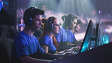 Fototapeta  - Young and successful men and women professional gamers with coach playing video game on computers against monitor with match broadcast during esports tournament