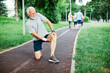 outdoor senior fitness man lifestyle active sport exercise injury pain ache leg knee ancle