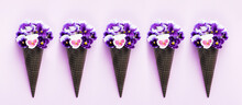 Waffle Cones With  Flower Bouquet Pansies On Lilac Background. Flat Lay, Banner, Creative Concept.