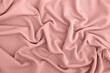 pink background texture of knitted wool. Knitted fabric.
