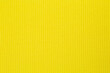 Yellow background texture of knitted wool. Knitted fabric.