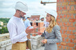 © zinkevych - Joyous building inspector talking to a young foreman