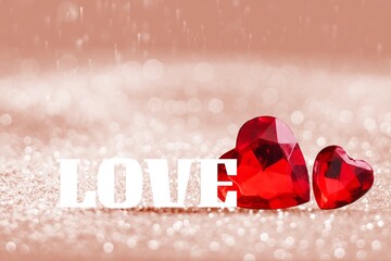 Canvas Print - Two red handmade hearts and word love on bright glitter lights bokeh background