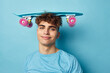 Attractive man sport skateboard posing isolated background