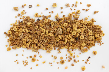 Wall Mural - frame of crunchy granola on white background, food concept