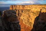 Fototapeta Góry - A stratification wall during a orange sunrise in the Grand Canyon National Park