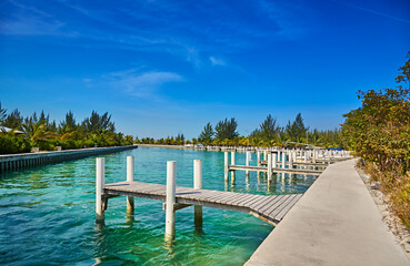 Wall Mural - Docks line the harbor at Sandy Point, North Caicos, Turks and Caicos Islands