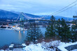 View of Lions Gate suspension Bridge in Vancouver, British Columbia, Canada at night in winter full of lights
