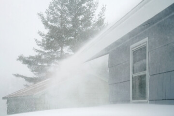 Poster - strong wind blowing snow off the roof in blizzard