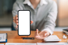 Mock Up. Woman Holding Mobile Phone Showing Blank White Screen For Text Message Or Information.