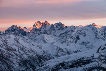 Wall Mural - Snowy Greater Caucasus ridge. Mount. Ushba. Sunset. Panoramic view. Elbrus region, Kabardino-Balkaria, Russia