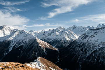 Wall Mural - Snowy Greater Caucasus ridge. Sunny day. Before suset. View from 3500m