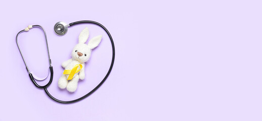 Poster - Bunny toy and golden awareness ribbon with stethoscope on color background with space for text. International Childhood Cancer Day