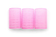 Pink hair curlers on light background
