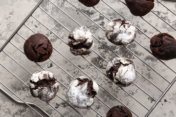 Grid with tasty chocolate brownie cookies on light grunge background