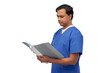 © Syda Productions - healthcare, profession and medicine concept - indian doctor or male nurse in blue uniform with folder reading medical report over white background