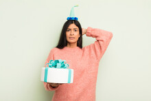 Young Pretty Hispanic Woman Feeling Stressed, Anxious Or Scared, With Hands On Head. Birthday Cake Concept