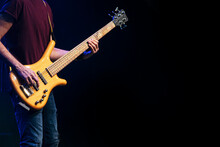Bass Player Performing At A Live Concert.
