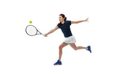 Portrait of young sportive woman, tennis player playing tennis isolated on white background. Healthy lifestyle, fitness, sport, exercise concept.