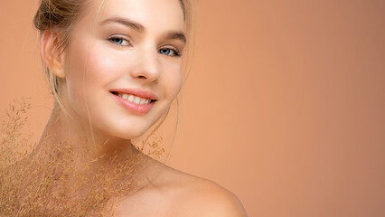 Poster - Portrait of young smiling woman with a healthy  skin of a face. Happy girl with a spring field flowers