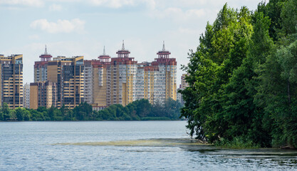 Wall Mural - Beautiful nature landscape with Voronezh river and new houses on other bank in summer evening. Romantic nature concept for design. There is a place for your text. Voronezh, Russia - June 17, 2019