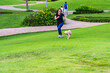 © Quang - Asian girl running with cute golden dog in park