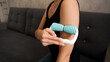 © brillianata - Woman massaging herself with body roller at home. Massage after sports. Health concept