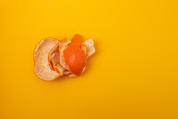 Sticker - fresh orange mandarin peel on yellow background