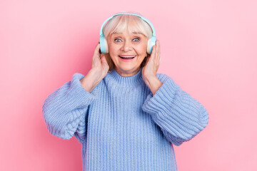 Sticker - Portrait of attractive amazed cheerful grey-haired woman listening sound bass hit isolated over pink pastel color background