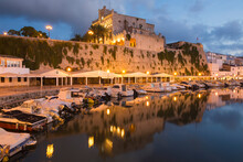 View Across Tranquil Harbour To The Illuminated Town Hall At Dusk, Ciutadella (Ciudadela), Menorca, Balearic Islands