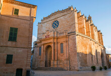 Golden Sandstone Facade Of The Cathedral Of Santa Maria, Sunrise, Ciutadella (Ciudadela), Menorca, Balearic Islands