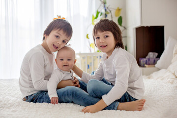 Poster - Little toddler and preschool boys, playing with their little brother