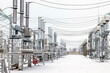 © Алексей Кравчук - High voltage equipment of a high voltage electrical substation in winter. High voltage transformer substation. Selective focus.