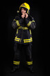 © blanke1973 - Firefighter in full firefighting gear on a black background